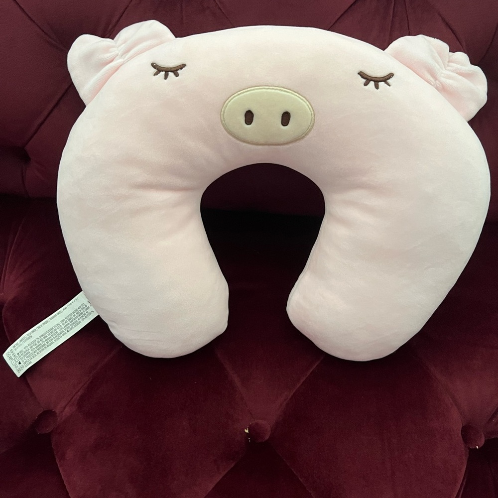 Pale pink pig neck pillow